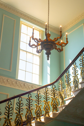 Georgian Stairway with chandelier hanging from  ceiling